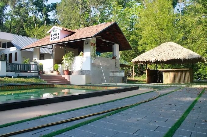 Gazebo and pool area at Jeevika Haven in daylight