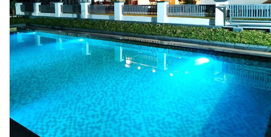 Jeevika Haven pool lit up at night